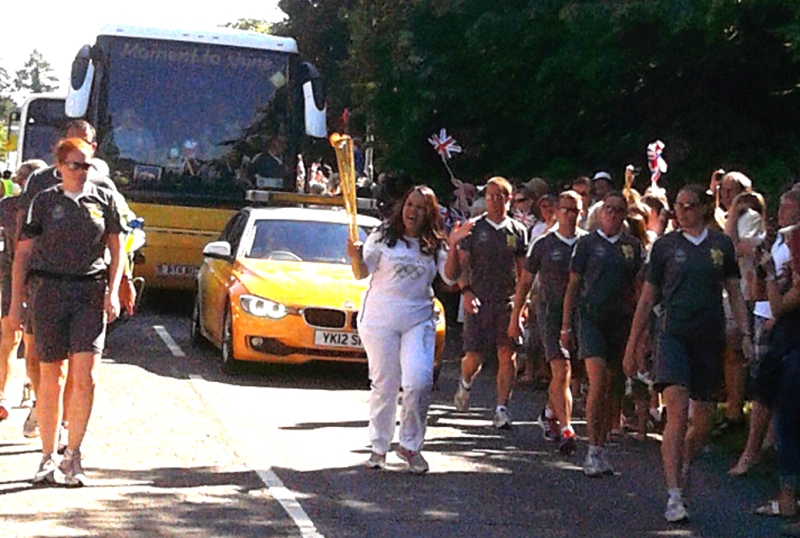 Lianne Corriette runs the torch through Denham